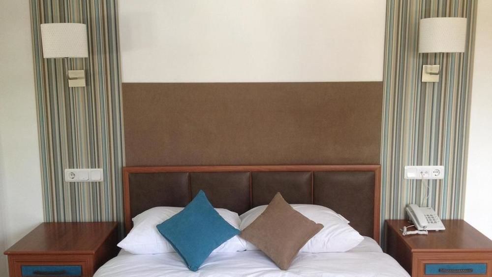 Oskay Hotel Далян Екстериор снимка