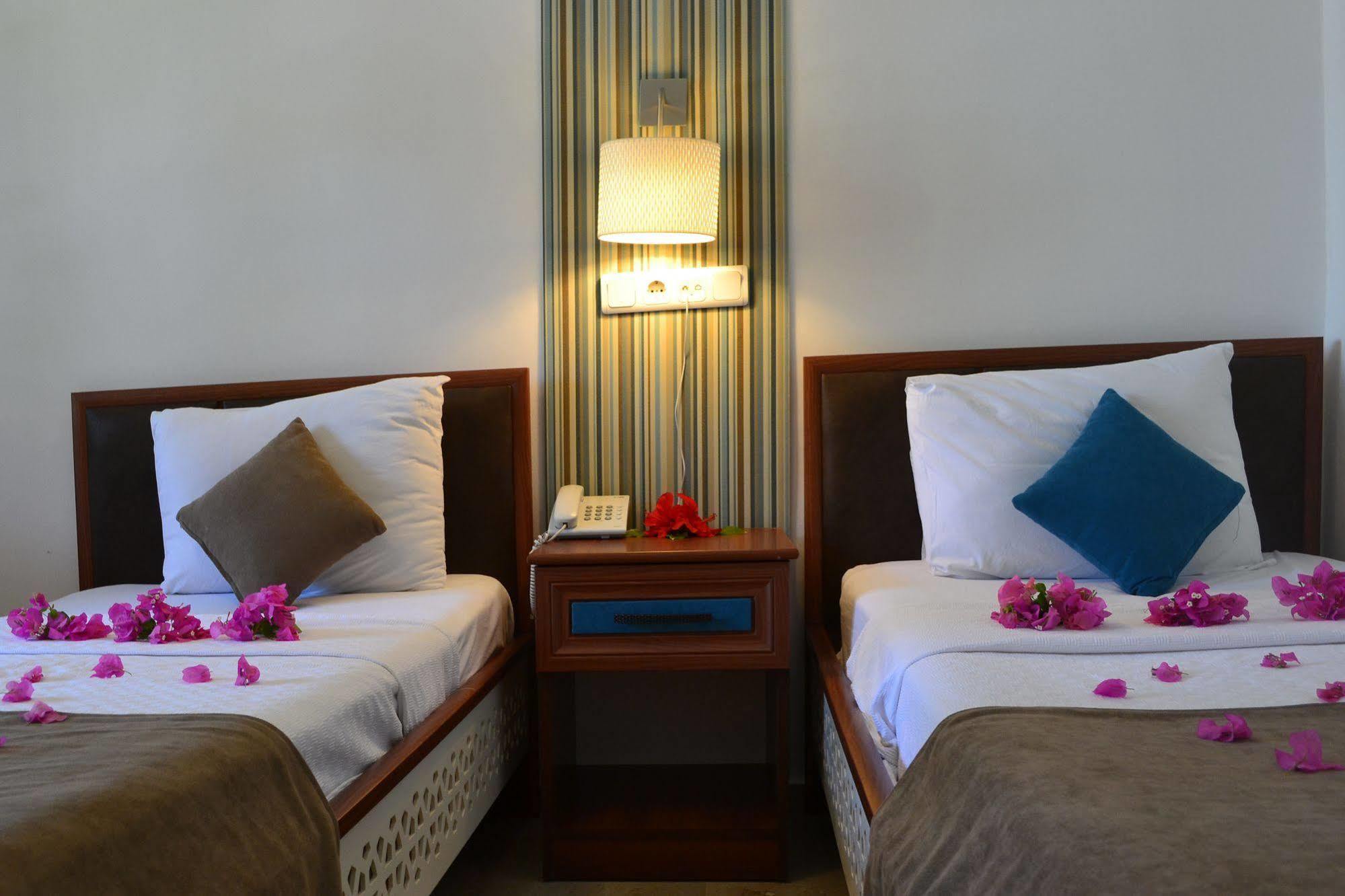 Oskay Hotel Далян Екстериор снимка
